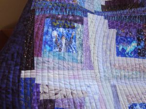 Spiral quilting and wonky log cabin blocks